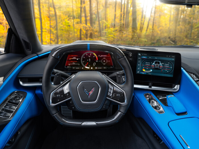 View from drivers seat in 2024 Chevrolet Corvette E-Ray 3LZ coupe in Silver Flare with Two Tone Blue Interior. Pre-production model shown. Actual production model may vary. Model year 2024 Corvette E-Ray available 2023.